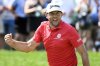 Keegan Bradley reacts to making birdie putt to a tie for the lead on the ninth hole during the final round of the Travelers Championship golf tournament at TPC River Highlands, Sunday, June 22, 2025, in Cromwell, Conn. (AP Photo/Jessica Hill)