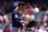 Seattle Mariners starting pitcher George Kirby gets set to pitch during the first inning of a baseball game against the Los Angeles Angels, Sunday, June 8, 2025, in Anaheim, Calif. (AP Photo/Mark J. Terrill)