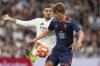 FILE - Celta's Fer Lopez, right, and Real Madrid's Dani Ceballos challenge for the ball during the Spanish La Liga soccer match between Real Madrid and Celta Vigo at the Santiago Bernabeu stadium in Madrid, Spain, on May 4, 2025. (AP Photo/Jose Breton, File)
