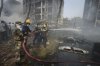 Firefighters work at the site of an airplane that crashed in India's northwestern city of Ahmedabad in Gujarat state, Thursday, June 12, 2025. (AP Photo/Ajit Solanki)