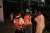 People react next to a building struck by a missile fired from Iran, in Tel Aviv, Israel, on Friday, June 13, 2025. (AP Photo/Tomer Appelbaum)