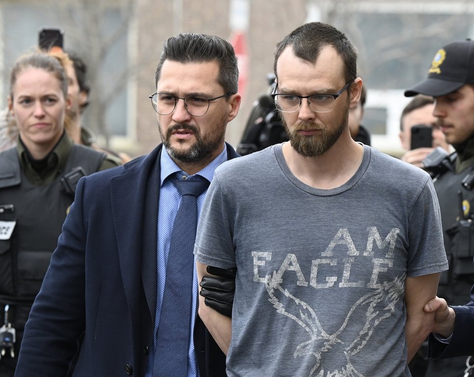 Steeve Gagnon is escorted by police out of court in Amqui, Que., Tuesday, March 14, 2023. THE CANADIAN PRESS/Jacques Boissinot
