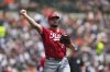 Cincinnati Reds pitcher Graham Ashcraft (23) throws to first base for an out on a Detroit Tigers' Parker Meadows bunt in the seventh inning during a baseball game, Sunday, June 15, 2025, in Detroit. (AP Photo/Paul Sancya)
