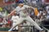 New York Mets pitcher José Buttó (70) works in the fourth inning of a baseball game against the Atlanta Braves, Wednesday, June 18, 2025, in Atlanta. (AP Photo/Mike Stewart)