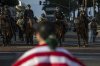 Police confront a protesters outside City Hall during protests over federal immigration enforcement raids on Wednesday, June 11, 2025, in Los Angeles. (AP Photo/Ethan Swope)