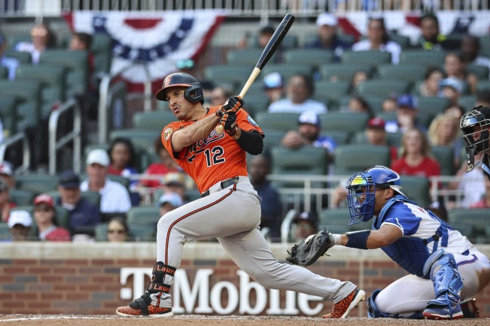 Baltimore Orioles' Ramón Laureano (12) hits an RBI double in the 10th inning of a baseball game against the Atlanta Braves, Saturday, July 5, 2025, in Atlanta. (AP Photo/Colin Hubbard)