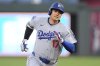 Los Angeles Dodgers' Shohei Ohtani runs to third after hitting a triple during the fifth inning of a baseball game against the Kansas City Royals, Friday, June 27, 2025, in Kansas City, Mo. (AP Photo/Charlie Riedel)