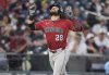 Arizona Diamondbacks' Eugenio Suárez gestures as he heads down the third base line after hitting a two-run home run off Colorado Rockies relief pitcher Ryan Rolison in the sixth inning of a baseball game Friday, June 20, 2025, in Denver. (AP Photo/David Zalubowski)