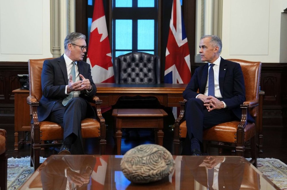 Prime Minister of Canada Mark Carney, right, meets with Prime Minister of the United Kingdom Keir Starmer in his office on Parliament Hill in Ottawa on Sunday, June 15, 2025. THE CANADIAN PRESS/Justin Tang