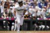 Seattle Mariners designated hitter Cal Raleigh tosses his bat after hitting a two-run home run during the first inning of a baseball game against the Pittsburgh Pirates, Friday, July 4, 2025, in Seattle. (AP Photo/Ryan Sun)