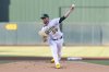 Athletics pitcher Jeffrey Springs throws to the Cleveland Guardians during the first inning of a baseball game Friday, June 20, 2025, in West Sacramento, Calif. (AP Photo/Sara Nevis)