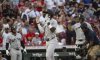 New York Yankees' Jazz Chisholm Jr. throws his hands up in celebration after hitting a home run in third inning of a baseball game against the Cincinnati Reds, Wednesday, June 25, 2025, in Cincinnati. (AP Photo/Michael Swensen)