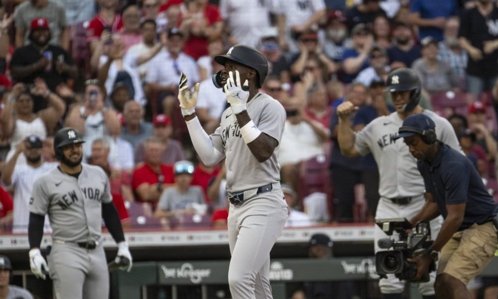 New York Yankees' Jazz Chisholm Jr. throws his hands up in celebration after hitting a home run in third inning of a baseball game against the Cincinnati Reds, Wednesday, June 25, 2025, in Cincinnati. (AP Photo/Michael Swensen)