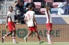 Canada's Nathan Saliba, right, celebrates his goal against Curaca in front of Jonathan David, left, and Zorhan Bassong (3) during a CONCACAF Gold Cup soccer match Saturday, June 21, 2025, in Houston, Texas. (AP Photo/Michael Wyke)