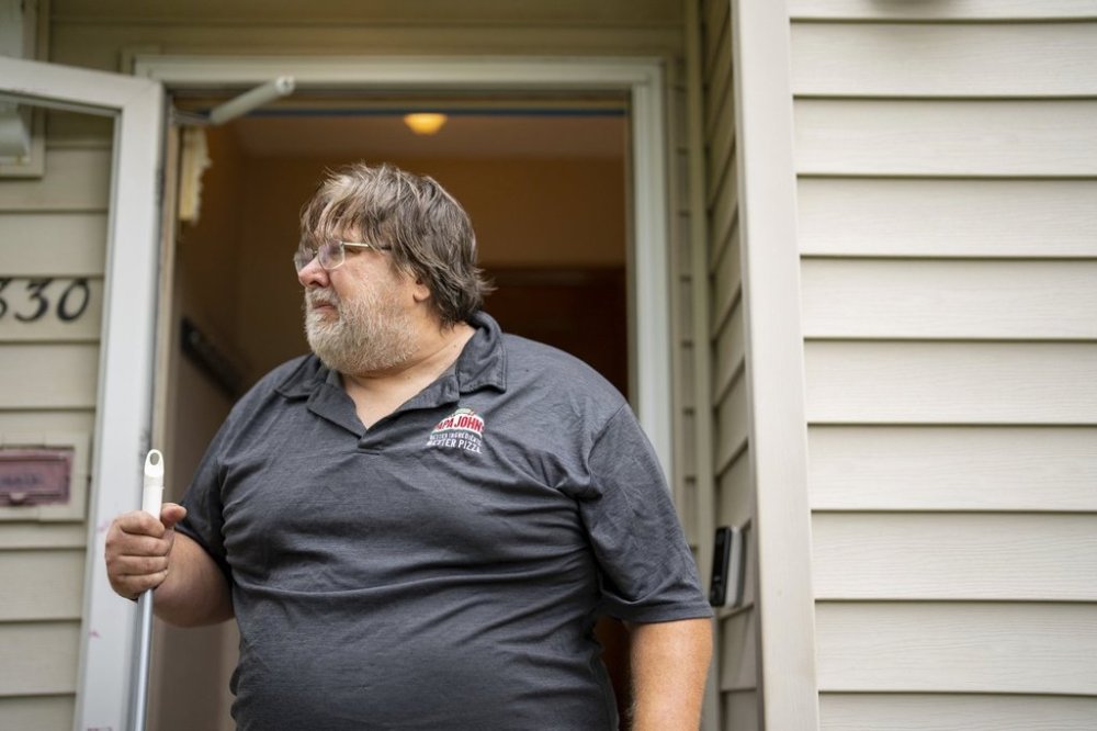 David Carlson, Vance Boelter's best friend since fourth grade, tears up as he talks about Boelter outside their shared residence on Fremont Ave. N. in Minneapolis, Minn., Saturday, June 14, 2025. (Alex Kormann/Star Tribune via AP)