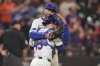 New York Mets pitcher David Peterson hugs catcher Luis Torrens after a baseball game against the Washington Nationals Wednesday, June 11, 2025, in New York. (AP Photo/Frank Franklin II)