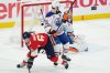 Florida Panthers' Brad Marchand (63) is checked by Edmonton Oilers' Jake Walman (96) as goalie Stuart Skinner (74) makes a save during the first period in Game 3 of the Stanley Cup final in Sunrise, Fla., on Monday, June 9, 2025. THE CANADIAN PRESS/Nathan Denette