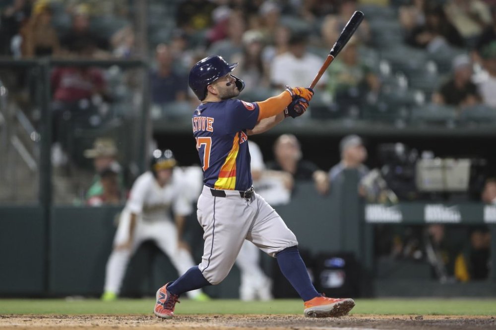 Houston Astros' Jose Altuve hits a three run home run against the Athletics during the sixth inning of a baseball game Wednesday, June 18, 2025, in West Sacramento, Calif. (AP Photo/Scott Marshall)