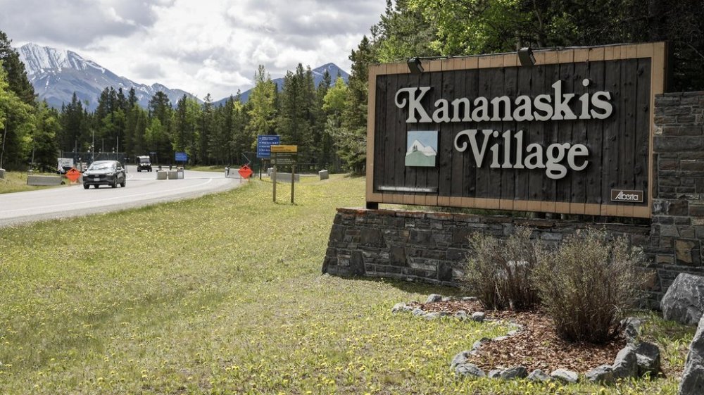 Vehicles pass a security gate and fence outside the site of the G7 Leaders meeting in Kananaskis, Alta., Monday, June 2, 2025. THE CANADIAN PRESS/Jeff McIntosh