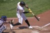 Pittsburgh Pirates' Tommy Pham doubles off Texas Rangers pitcher Caleb Boushley, driving in a run, during the fifth inning of a baseball game in Pittsburgh, Sunday, June 22, 2025. (AP Photo/Gene J. Puskar)