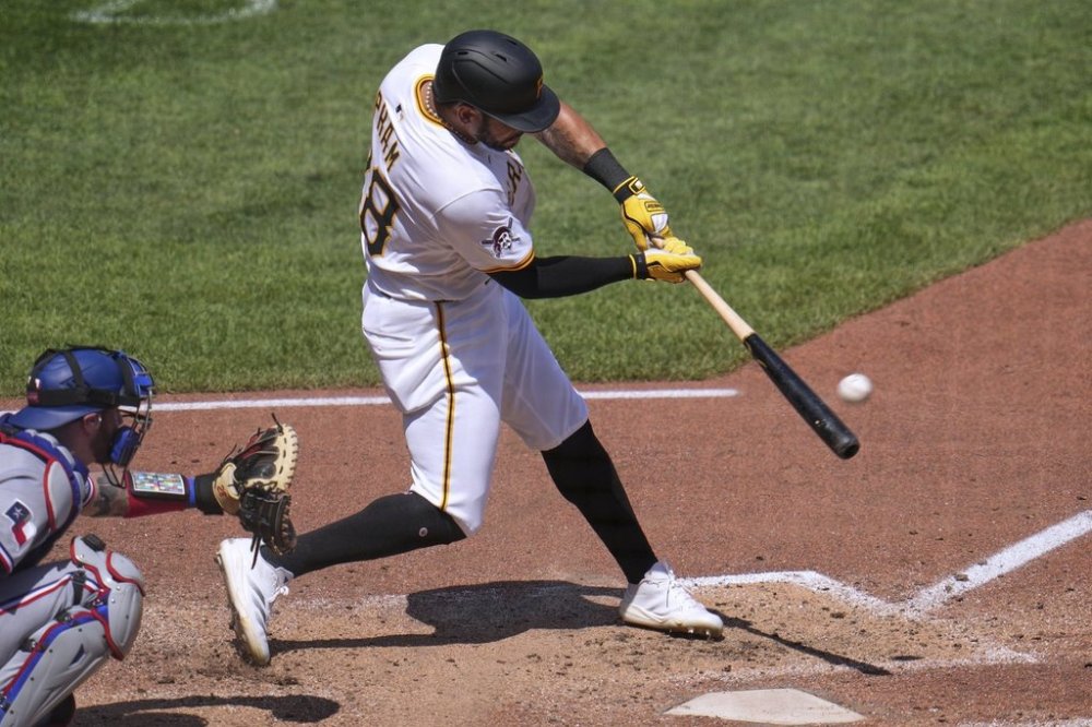 Pittsburgh Pirates' Tommy Pham doubles off Texas Rangers pitcher Caleb Boushley, driving in a run, during the fifth inning of a baseball game in Pittsburgh, Sunday, June 22, 2025. (AP Photo/Gene J. Puskar)