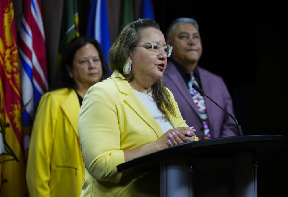 AFN National Chief Cindy Woodhouse Nepinak, middle, takes part in a press conference with Chair of the B.C. First Nations Justice Council Kory Wilson (Hemas Kla-Lee-Lee-Kla), left back, and Regional Chief Terry Teegee on Parliament Hill in Ottawa on Wednesday, June 11, 2025. THE CANADIAN PRESS/Sean Kilpatrick
