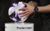 FILE - A referee picks up the match ball ahead of the English Premier League soccer match between Sheffield United and Arsenal at Bramall Lane in Sheffield, England, on March 4, 2024. (AP Photo/Rui Vieira, File)