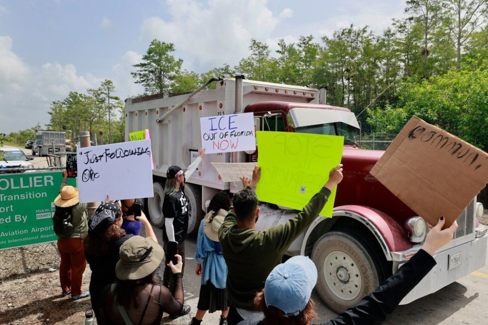 Environmental advocates and protesters at the Dade-Collier Training and Transition Airport on Tamiami Trail E, Ochopee, Fla., on Saturday, June 28, 2025, object to the