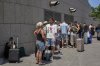 Citizens of Poland and Austria assemble at a hotel in Tel Aviv, Israel, for evacuation amid heavy strikes on Israel by Iran on Tuesday, June 17, 2025. (AP Photo/Baz Ratner)