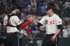 Texas Rangers pitcher Robert Garcia (62) celebrates after the final out with catcher Jonah Heim (28) in the ninth inning of a baseball game against the Chicago White Sox, Friday, June 13, 2025, in Arlington, Texas. (AP Photo/LM Otero)