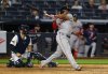 Boston Red Sox designated hitter Rafael Devers (11) follows through on a home run during the ninth inning of a baseball game against the New York Yankees, Sunday, June 8, 2025, in New York. (AP Photo/Noah K. Murray)