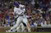 Chicago Cubs designated hitter Seiya Suzuki (27) hits a two-run single during the fourth inning of a baseball game against the Cleveland Guardians, Wednesday, July 2, 2025, in Chicago. (AP Photo/Erin Hooley)