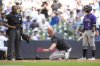Colorado Rockies interim manager Warren Schaeffer, middle, gestures to an umpire after being ejected during the third inning of a baseball game against the Milwaukee Brewers, Sunday, June 29, 2025, in Milwaukee. (AP Photo/Aaron Gash)