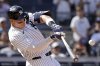 New York Yankees' Aaron Judge hits a two-run home run during the seventh inning of a baseball game against the Athletics, Sunday, June 29, 2025, in New York. (AP Photo/Adam Hunger)
