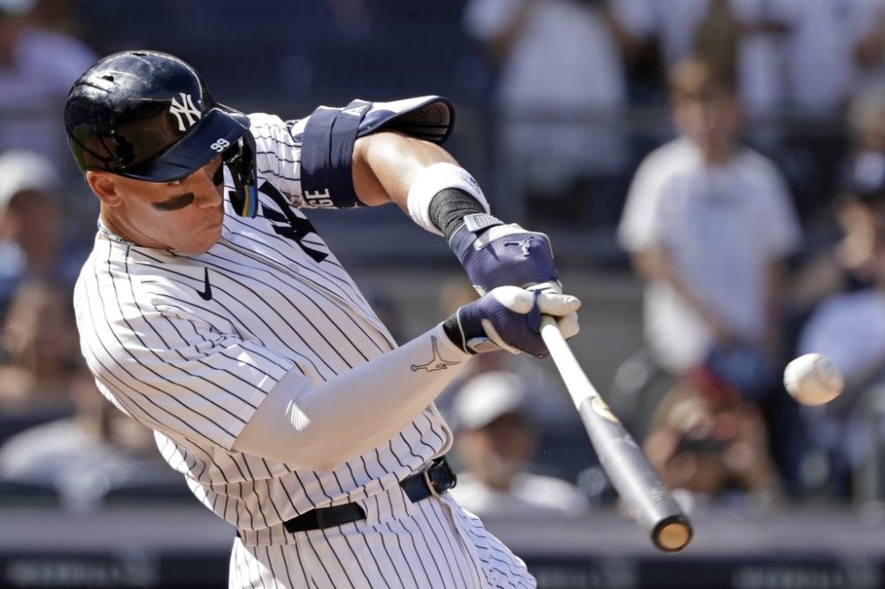 New York Yankees' Aaron Judge hits a two-run home run during the seventh inning of a baseball game against the Athletics, Sunday, June 29, 2025, in New York. (AP Photo/Adam Hunger)