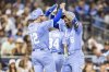 Kansas City Royals' Nick Loftin (12) celebrates after a home run by Jonathan India (6) in the fifth inning of a baseball game against the San Diego Padres, Friday, June 20, 2025, in San Diego. (AP Photo/Tony Ding)