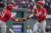 Cincinnati Reds' Jake Fraley, right, is congratulated by teammate TJ Friedl (29) after hitting a home run in the fourth inning of a baseball game against the Cleveland Guardians in Cleveland, Monday, June 9, 2025. (AP Photo/Sue Ogrocki)