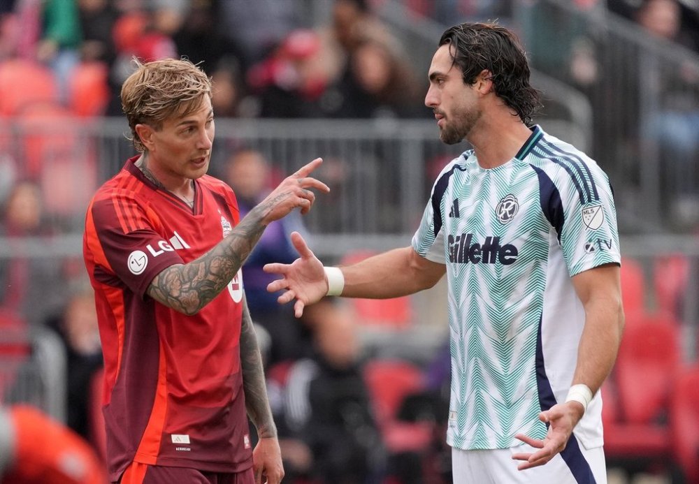 Toronto FC forward Federico Bernardeschi (10) and New England Revolution forward Leonardo Campana (9) argue during first half MLS soccer action in Toronto, Saturday, May 3, 2025. THE CANADIAN PRESS/Frank Gunn