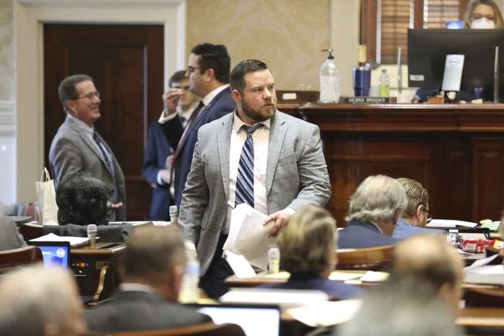 FILE - South Carolina Rep. RJ May, R-West Columbia, walks down the aisle of the House on Tuesday, March 14, 2023, in Columbia, South Carolina. (AP Photo/Jeffrey Collins, File)