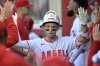 Los Angeles Angels' Zach Neto is congratulated in the dugout after hitting a solo home run during the first inning of a baseball game against the Boston Red Sox, Monday, June 23, 2025, in Anaheim, Calif. (AP Photo/Jayne Kamin-Oncea)