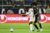Los Angeles Galaxy forward Joseph Paintsil, left, and Vancouver Whitecaps forward Jayden Nelson vie for the ball during the second half of an MLS soccer match Friday, July 4, 2025, in Carson, Calif. (AP Photo/William Liang)
