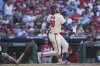 Philadelphia Phillies' Alec Bohm watches his two-run home run off Cincinnati Reds pitcher Nick Lodolo during the sixth inning of a baseball game, Saturday, July 5, 2025, in Philadelphia. (AP Photo/Derik Hamilton)