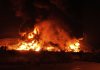 Flames rise from an oil storage facility after it appeared to have been hit by an Israeli strike in Tehran, Iran, early Sunday, June 15, 2025. (AP Photo/Vahid Salemi)
