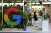 Participants make their way through a Google booth and display at the APEC summit in Lima, Peru on Friday, Nov. 15, 2024. THE CANADIAN PRESS/Sean Kilpatrick