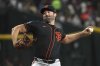 San Francisco Giants pitcher Robbie Ray throws against the Arizona Diamondbacks in the first inning during a baseball game, Thursday, July 3, 2025, in Phoenix. (AP Photo/Rick Scuteri)