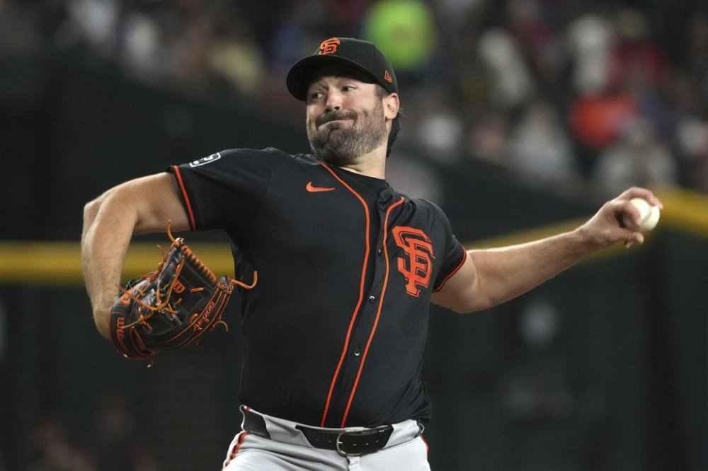 San Francisco Giants pitcher Robbie Ray throws against the Arizona Diamondbacks in the first inning during a baseball game, Thursday, July 3, 2025, in Phoenix. (AP Photo/Rick Scuteri)