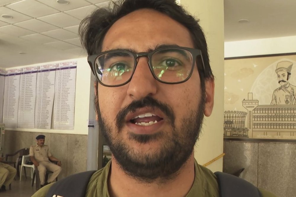 In this image taken from a video, Navin Chaudhary, a doctor who witnessed Thursday's Air India plane crash, speaks to The Associated Press in Ahmedabad, India, Monday, June 16, 2025. (AP Photo/Shonal Ganguly)