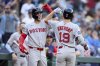 Boston Red Sox's Roman Anthony (19) is greeted by Marcelo Mayer, left, after hitting a solo home run off Seattle Mariners starting pitcher Logan Gilbert during the first inning of a baseball game Monday, June 16, 2025, in Seattle. (AP Photo/John Froschauer)