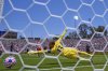 Atletico Madrid's goalkeeper Jan Oblak fails to block a shot by Paris Saint-Germain's Fabian Ruiz to score the opening goal during the Club World Cup group B soccer match between PSG and Atletico Madrid, in Pasadena, Calif., Sunday, June 15, 2025. (AP Photo/Mark J. Terrill)