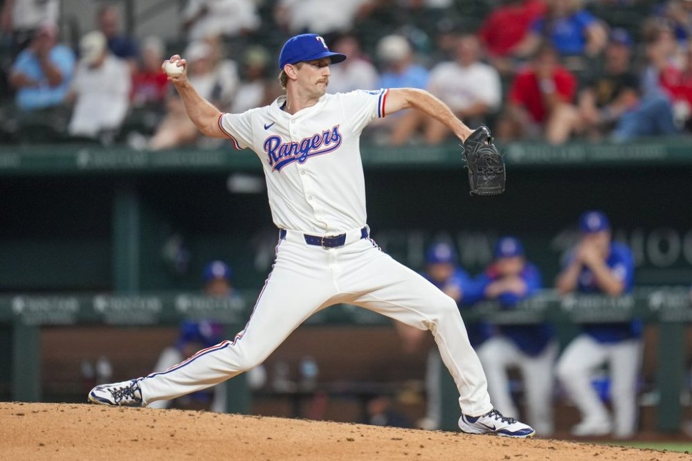 Texas Rangers pitcher Caleb Boushley throws a pitch to the Kansas City Royals during the ninth inning of a baseball game Tuesday, June 17, 2025, in Arlington, Texas. (AP Photo/Julio Cortez)